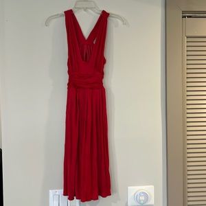 Red dress with gathers at waist and back, low cut, sexy